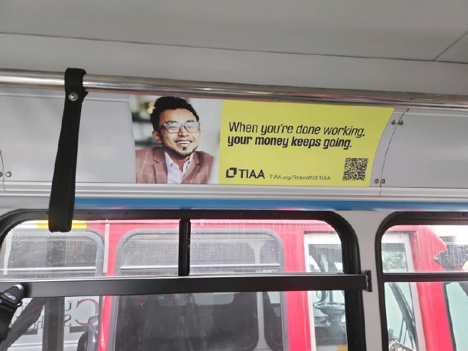 Live campaign image - TIAA bus card on USC bus.