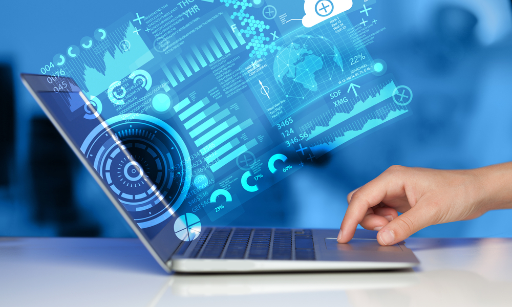 AI for marketing and strategy - person's hand pressing button on laptop computer emitting data